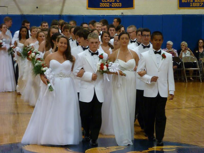 The officers of the BRHS Class of 2014, from left, president Evelyn Greenleaf, treasurer Myron Hahn, vice president Hannah Winslow and Jude Alamo lead the four-abreast portion of the Grand March. KATRINA CLARK/Boothbay Register
