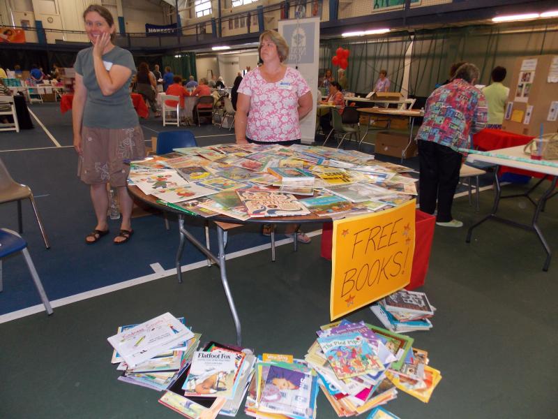 Janice Cotier mans the table of free books, most of which were donated by teachers. KATRINA CLARK/Boothbay Register