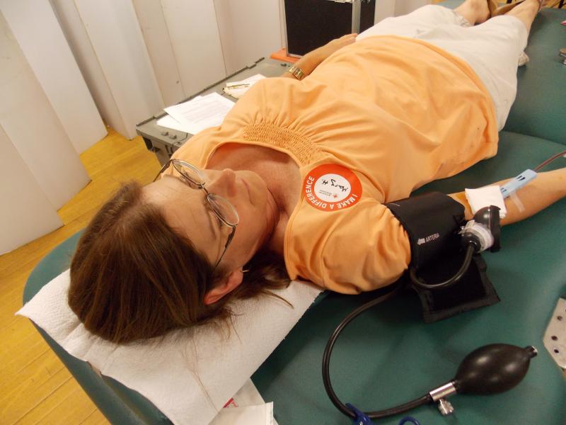 Mary Hanley keeps her arm still while donating blood. The process takes less than 10 minutes, according to the American Red Cross. KATRINA CLARK/Boothbay Register