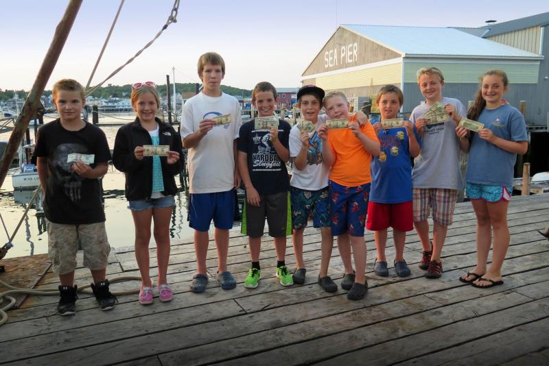 The winners of the Boothbay Region Fish and Game Association (youth division mackerel and pollock categories) show off their winnings. Courtesy of Steve Rubicam