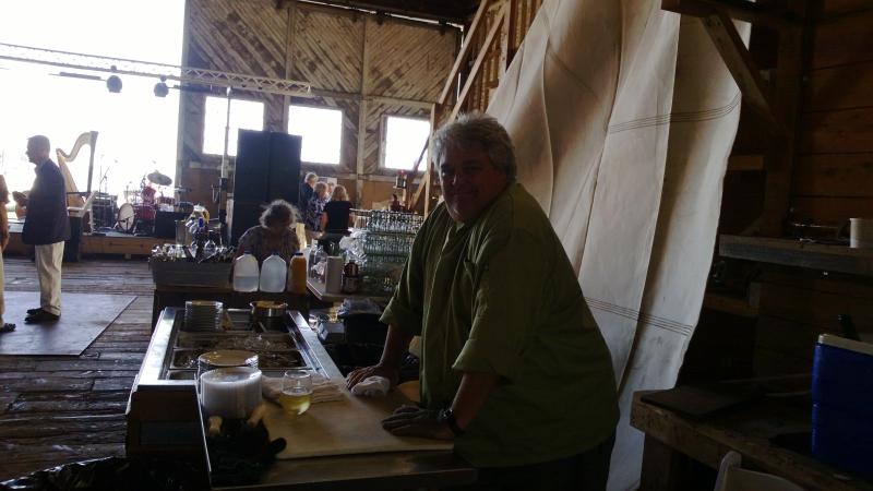 Ralph Smith, owner of several area restaurants, sets up the oyster bar. JANE CARPENTER/Boothbay Register