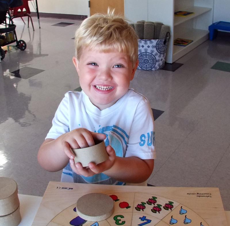 AIDAN JEWETT smiles for the camera on his first day at the new Harbor Montessori School in Boothbay Harbor. SUZI THAYER/Boothbay Register