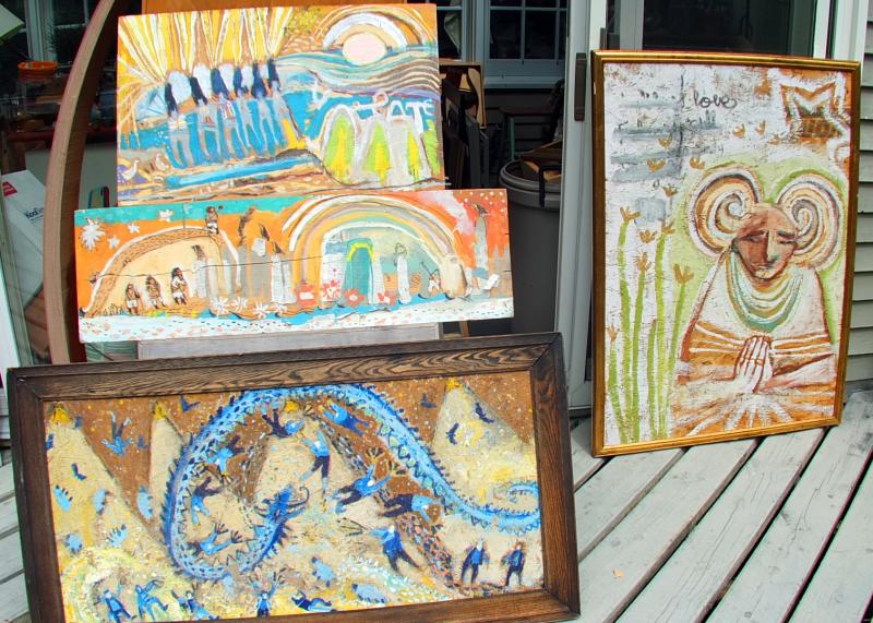 FOUR PAINTINGS by Douglas Desjardins that were saved from the junk wood pile at the dump in June. SUZI THAYER/Boothbay Register