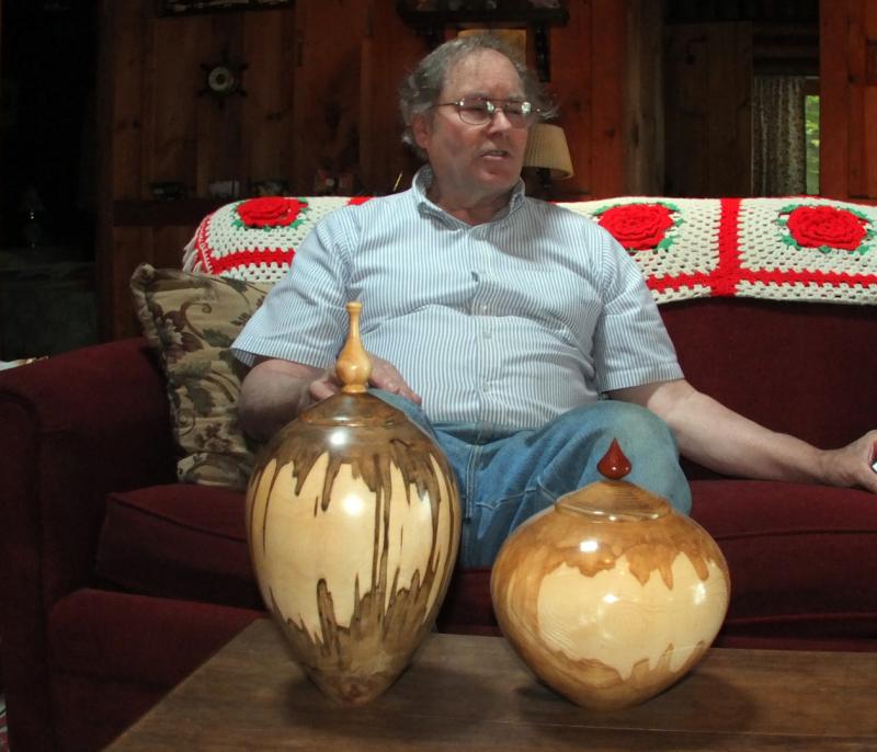 RICHARD CORSON holds court, with two of his lidded finial vases made from ambrosia maple, similar to the one he presented to Gov. Paul LePage, in the foreground. SUZI THAYER/Boothbay Register