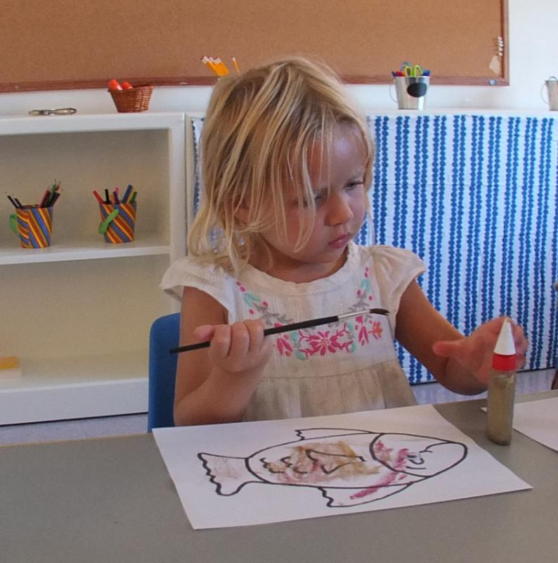 SHEA FRITZ paints a fish in the classroom of the new Harbor Montessori School. SUZI THAYER/Boothbay Register