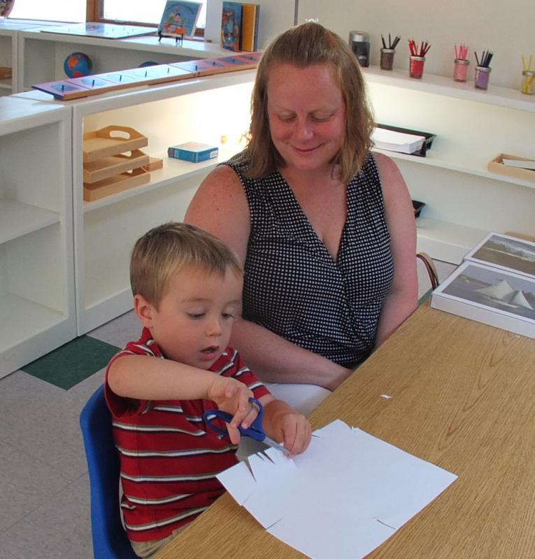 HENRY FULTON works on an art project while his mom Stacey Bennett watches. SUZI THAYER/Boothbay Register