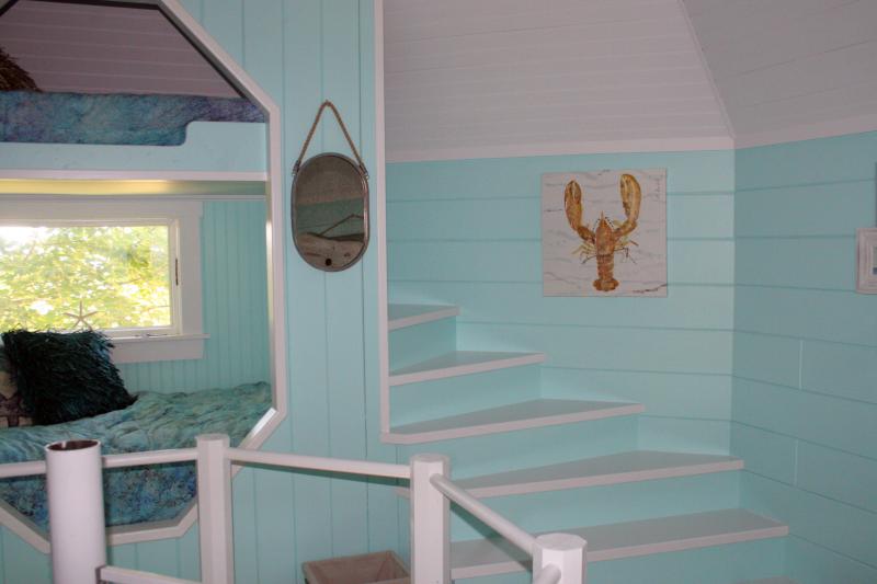 THE SECOND FLOOR of Campbell’s new treehouse has stairs spiraling up to the top bunks. SUZI THAYER/Boothbay Register