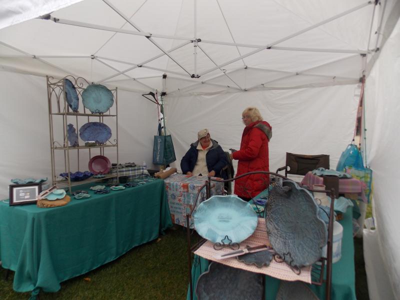 Joanna Skolfield of Blarney Stone Pottery, located in Scarborough, talks to a customer. KATRINA CLARK/Boothbay Register