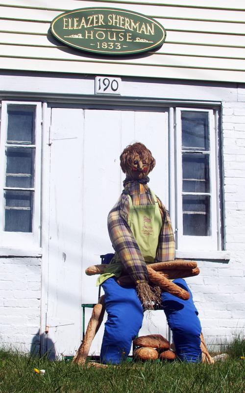 A baker displays his loaves of bread in front of the Eleazer Sherman House, where Kim Martin and Denise Demeter of Eventide live. SUZI THAYER/Boothbay Register