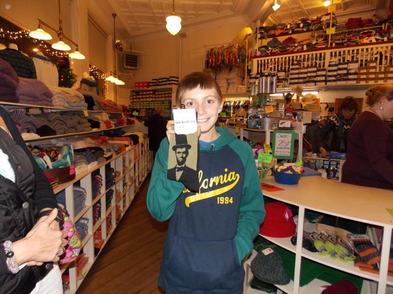 Chris Hamblett finds the perfect pair of socks for his sister Lincoln during Men’s Night at Jansons. KATRINA CLARK/Boothbay Register