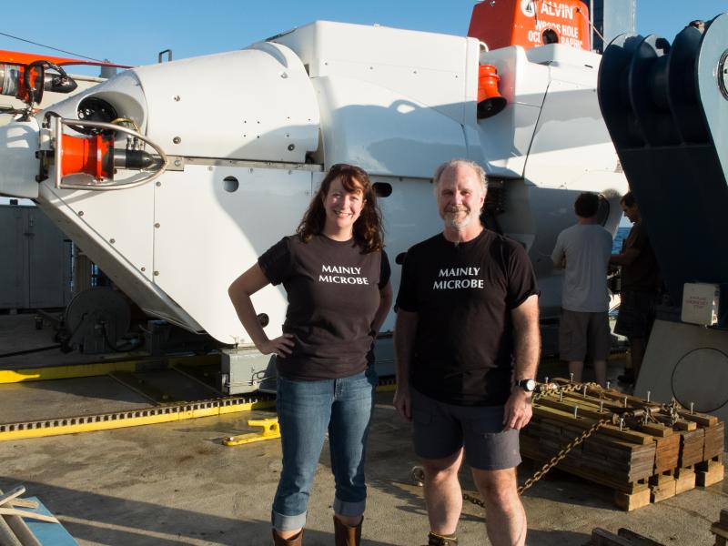 Doctors Beth Orcutt and Graham Shimmield after Alvin dive 4777. While Alvin looks quite large in the background, the total space for passengers is a sphere measuring 8 feet – much of which is taken up by equipment. Courtesy of chief scientist Geoff Wheat, Woods Hole Oceanographic Institution