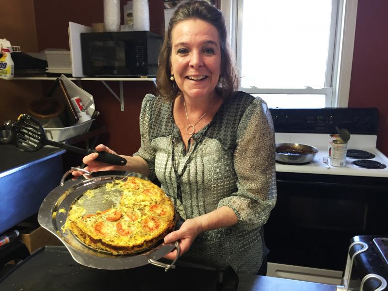 Stacey McLellan holds her quiche special of the day in the kitchen of her restaurant, Capers. SUZI THAYER/Boothbay Register