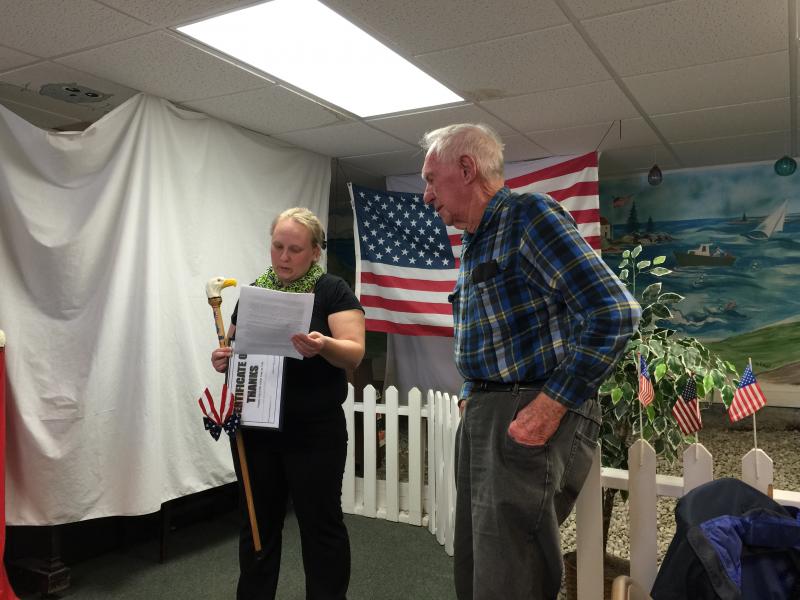 Amylynn Balsdon, left, presents a cane to her father-in-law Charles Balsdon. KATRINA CLARK/Boothbay Register