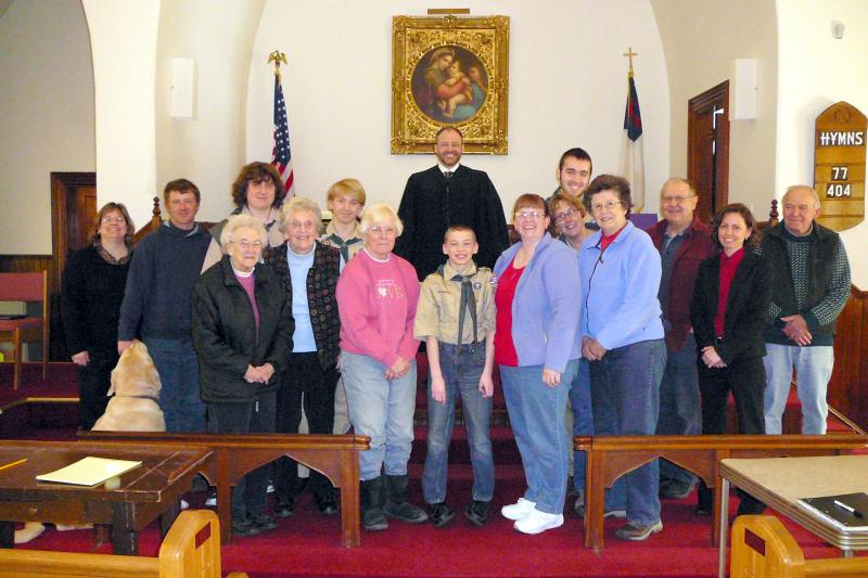 Participating in the mock trial at Southport Methodist Church on March 14 are, from left, back row: Kristi Poole (police officer), Joel Peaslee (former friend of the defendant), Jake Brewer (defendant), Draco Peaslee (defense attorney), Judge Charles Dow, Jacob Bishopp (prosecuting attorney for the state of Maine); front row: Ziggy (Troop 238 mascot), Troop Grandmothers Jean "Nini" Thompson, Evelyn "Mema" Sherman, and Nora "Grammy" Brewer (jurors); Ethan Barter (witness), Bonnie Wormwood, Tammy Blackman, Becky Singer, Jim Singer (jurors); Meegan Burbank (Attorney and merit badge counselor), Attorney Richard Elliott Sr. (Troop 238 mentor, juror and Eagle Scout). Missing from the photo was Sarah Sherman (Scoutmaster and juror). Courtesy of Sarah Sherman