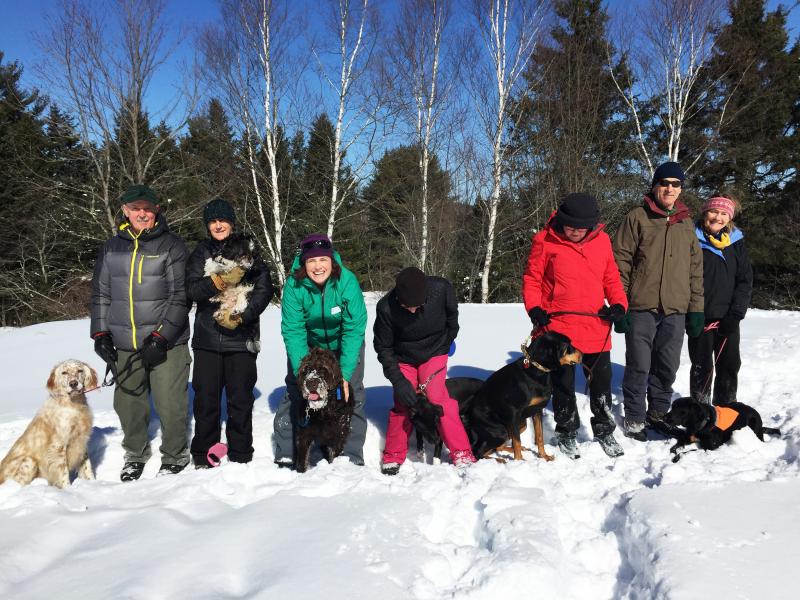 Six dogs and their humans took an hour hike at Penny Lake Preserve in Boothbay Harbor on Feb. 27. Left to right: Addie, Gary and Ida Clarke, with Elliot; Tracey and Cedar Hall; Diane and Jackson Gilman; Ellen and Jarhead Kearns; and Andy Abello, Amanda Russell and Maude. SUZI THAYER/Boothbay Register