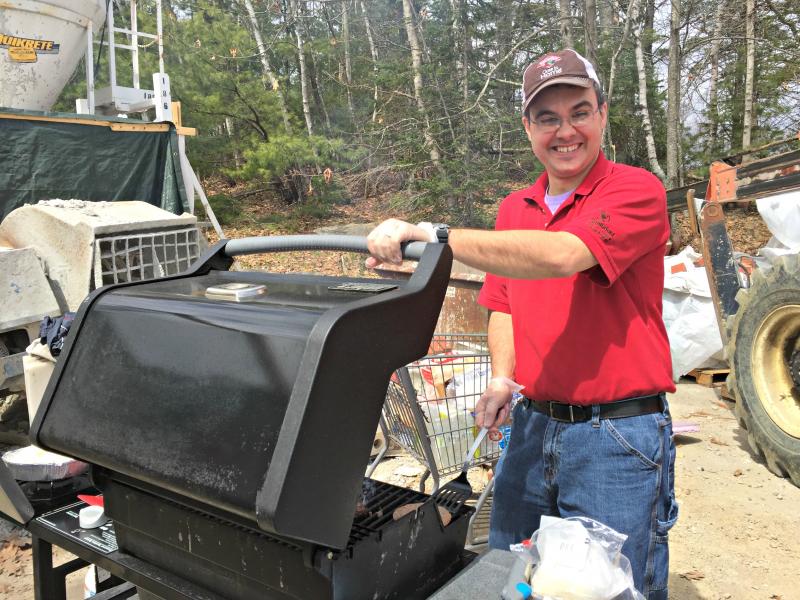 Jake Swartz mans the grill. KATRINA CLARK/Boothbay Register