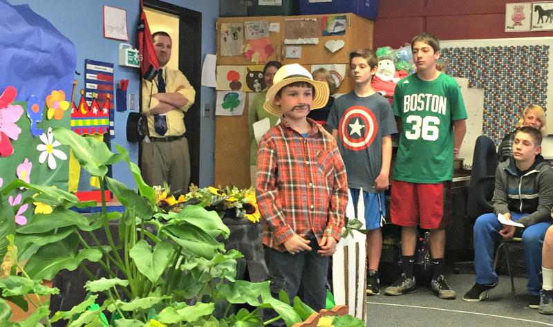 Vice Principal Brandon Ward (far left) stopped in to watch some of the play. Here Mr. McGregor (Cole Hyson) begins his search for Peter Rabbit, who is hiding in the tool shed. KATRINA CLARK/Boothbay Register