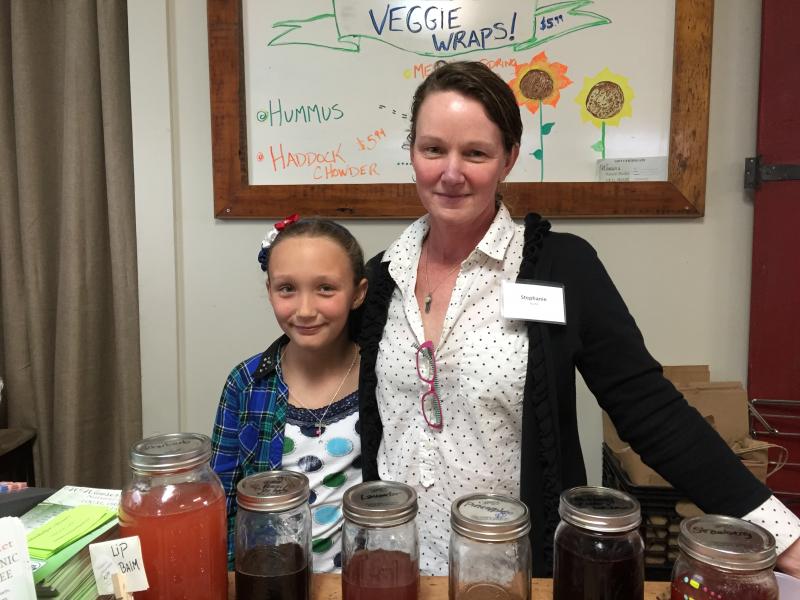 Stephanie Guite, right, with Teal Beavis, serving up her special balancing elixirs. KATRINA CLARK/Boothbay Register