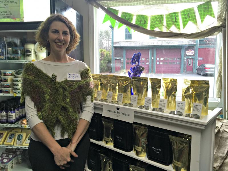 Mary Norwood next to her special tea display in Wanser's Natural Market at the Business After Hours. KATRINA CLARK/Boothbay Register