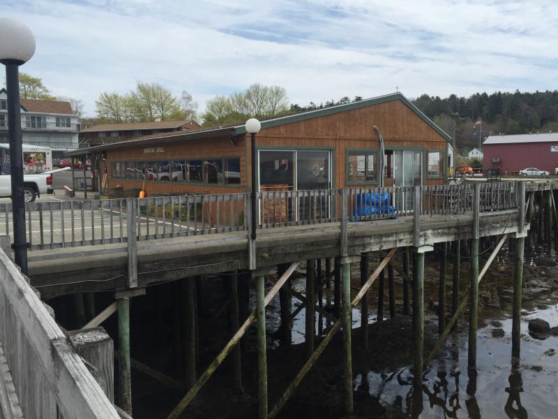 The new Cod's Head Fish House & BBQ, formerly the Dockside Grill. Workers are currently sprucing it up for the summer season. KATRINA CLARK/Boothbay Register