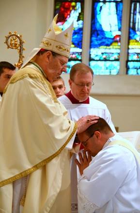 Father Steven Cartwright is ordained to the priesthood by Bishop Robert P. Deeley at the Cathedral of the Immaculate Conception in Portland on Saturday, June 13. Courtesy of Lois Czerniak, Roman Catholic Diocese of Portland