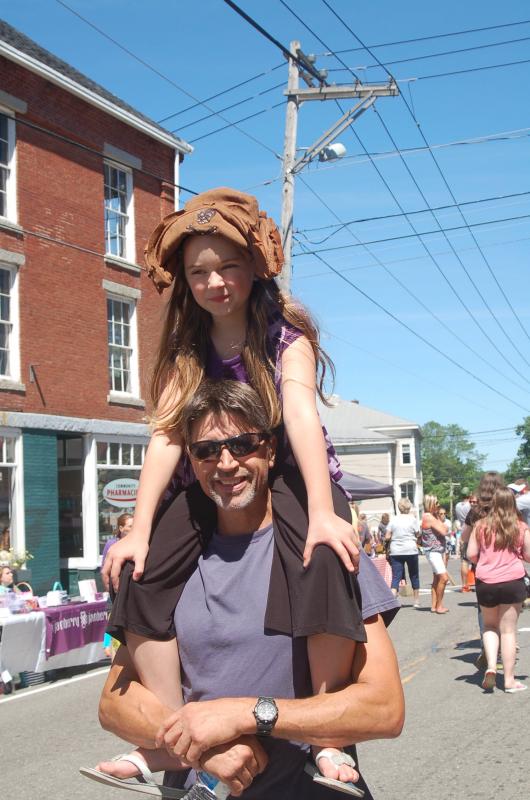 Tim Harriman gives Elizabeth a bird’s eye view of Waldoboro Day. ART MAYERS/Wiscasset Newspaper