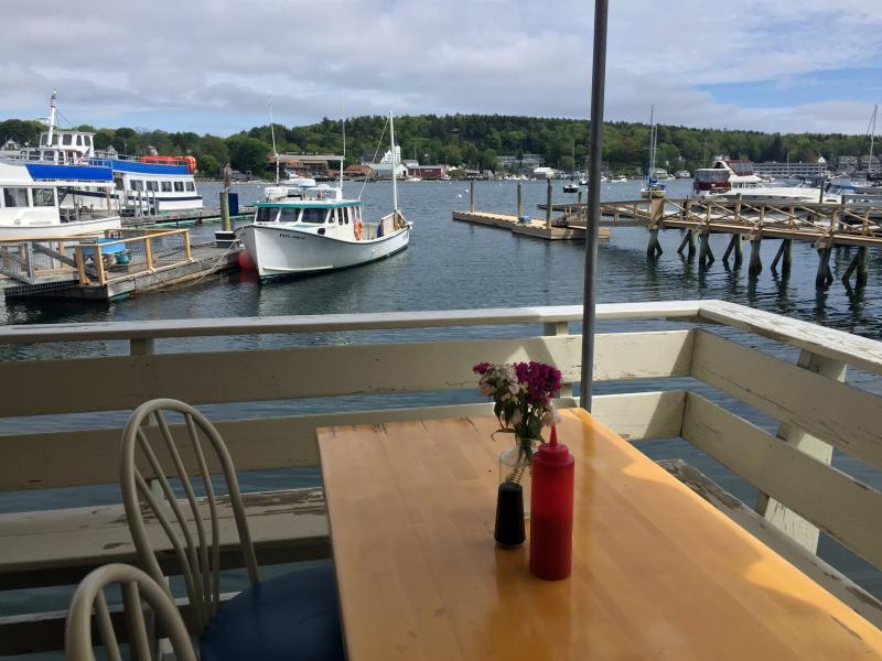 View of the harbor from the deck at Blue Moon Cafe. SUZI THAYER/Boothbay Register