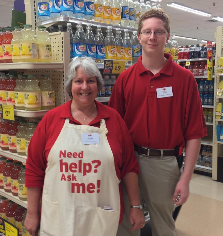 Robin Darden and Tyler Burge were on hand to answer questions and help customers locate items. SUZI THAYER/Boothbay Register