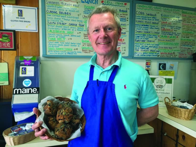 Fred Munro, owner and proprietor of Blue Moon Cafe, shows off some of his blueberry muffins, made daily at the cafe. SUZI THAYER/Boothbay Register