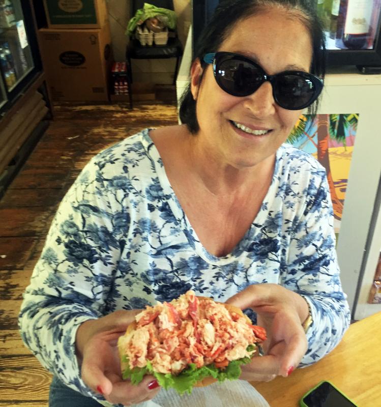 Elaine Athans, from Naples, Florida, makes it to the Trevett Country Store for lobster rolls every day she’s here. SUZI THAYER/Boothbay Register