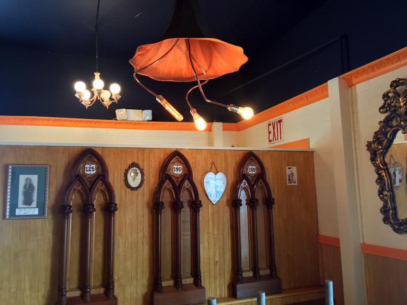 The four ceiling lights in Van Lloyd Bistro’s dining room are old Victrola horns that have been transformed into hanging art by the couple. SUZI THAYER/Wiscasset Newspaper
