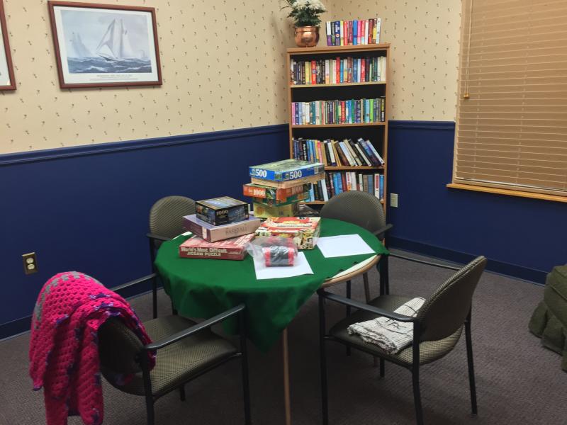 This room is set up for reading, puzzles and card playing, with lots of donated games and books. SUZI THAYER/Boothbay Register