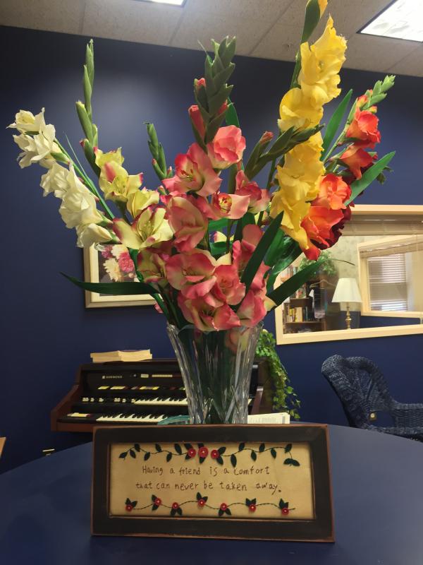 A sign reading: “Having a friend is a comfort that can never be taken away” greets visitors at the entrance of the new community center. SUZI THAYER/Boothbay Register