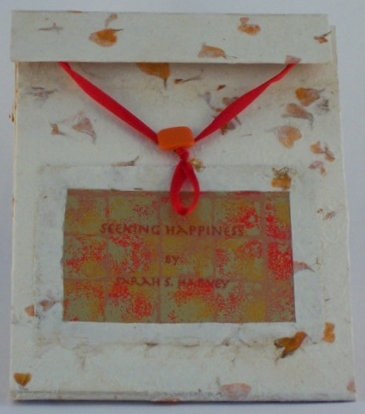 Sarah S. Harvey’s accordion artist book, “Seeking Happiness,” closed. Courtesy of the artist Sarah S. Harvey