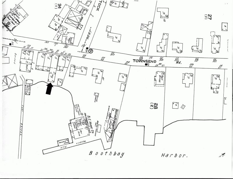 The 1922 Sanborn insurance map shows a stretch of Townsend Avenue from its intersection with Oak Street on the left north to Pottle Realty on the right, extending about halfway to Union Street. The large amount of vacant space east behind the houses is obvious. The one structure that seems to bar passage of a waterfront road is the addition on the east end of the present A Silver Lining; that addition has the legend "Open 1st" meaning one could pass under it. The arrow shows its location. Courtesy of Boothbay Region Historical Society