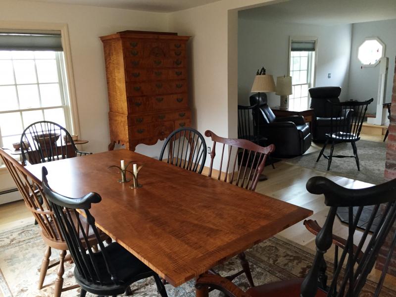 The dining area of Jeff Koopus’ home in Edgecomb features one of his dining tables and a chest in the far corner. Courtesy of Jeff Koopus