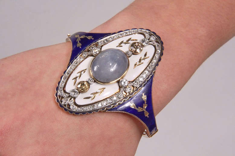 Victorian platinum and gold hinged bracelet with enamel decoration.