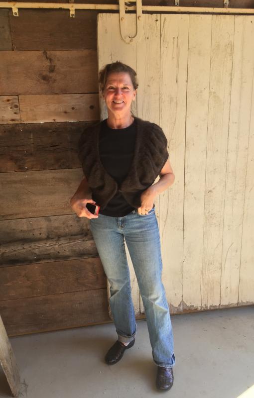 Anne Gobes models a shrug she fashioned from one of her alpaca’s spun wool. SUZI THAYER/Boothbay Register