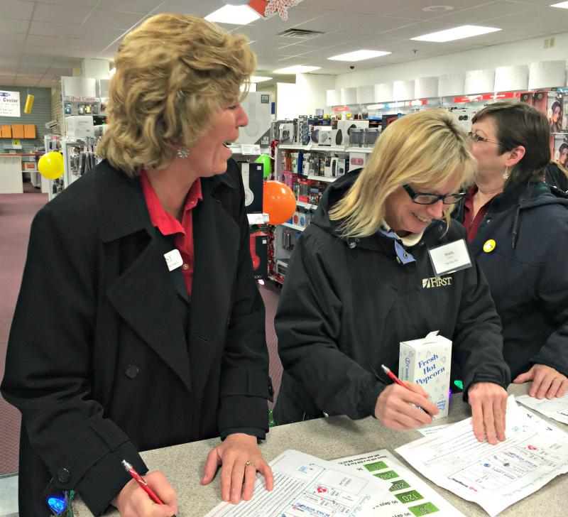 Ladies who work at The First Bank all did the scavenger hunt together. Here at Harbor-Tech Solutions (from left) Brenda Blackman, Shelley Smith, and Sherry Hodgdon figure out the question “What four departments make up Harbor-Tech Solutions”? The answer was US Cellular, Radio Shack, the photo lab, and office supplies. KATRINA CLARK/Boothbay Register