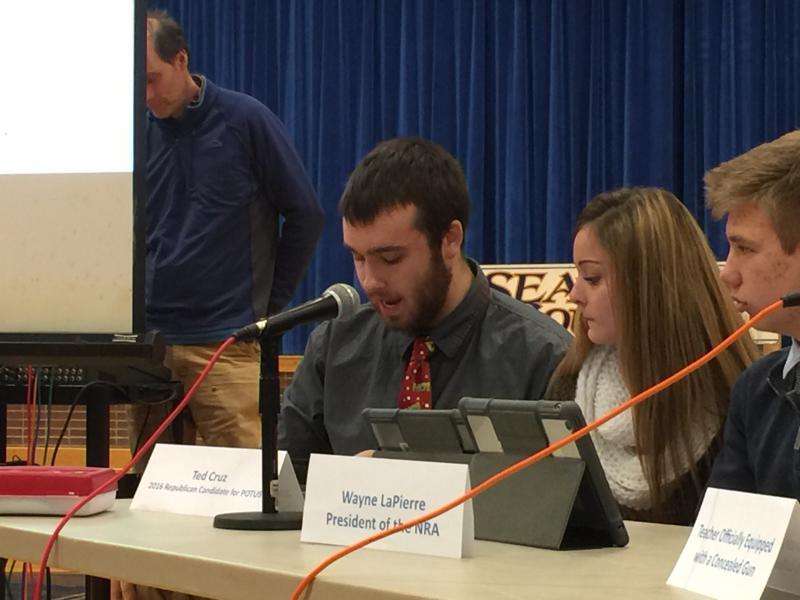 Junior Jacob Bishopp, in character as Ted Cruz, talks about protecting the rights of private citizens during the town hall debate. KATRINA CLARK/Boothbay Register