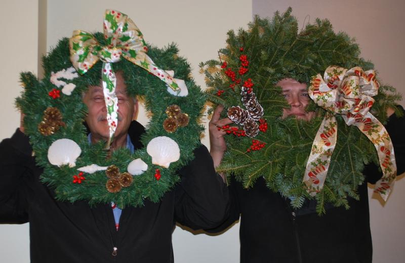 Doug Begin, left, and Gary Lawyerson show off their good fortune as drawing winners at the Christmas luncheon hosted by the St. Andrews Auxiliary for all employees of St. Andrews Village and the St Andrews Campus of LincolnHealth. Cheri Brewer, not pictured, won the centerpiece from the Village. Courtesy of Ann Kelley/St. Andrews Auxiliary