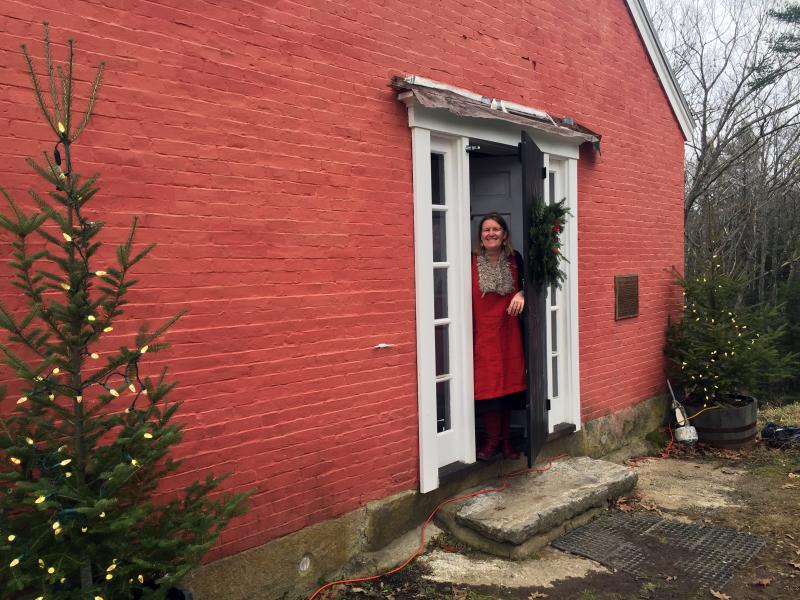 Susie Stephenson stands in the doorway of her new business, Stephenson Fiber Arts, on River Road in Edgecomb. SUZI THAYER/Boothbay Register