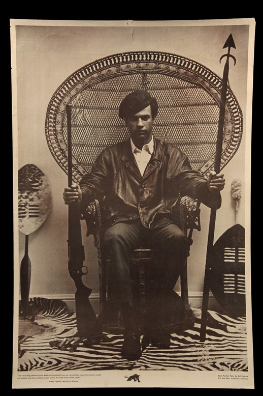 6. Huey Newton seated in wicker chair, 1 of 4 original 1960s Black Panther Party posters to be offered in this auction. Huey Newton weapons poster