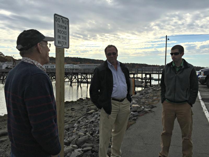 A recent meeting at the footbridge parking lot to determine the feasibility of an improvement project. The footbridge parking lot is one of the town-owned properties that will be directly impacted by the rise in sea levels over the next 50 to 100 years.From left: Selectmen’s Vice Chairman Bill Hamblen, Town Manager Tom Woodin, and Dan Courtemanch of the Maine Department of Environmental Protection. KATRINA CLARK/Boothbay Register