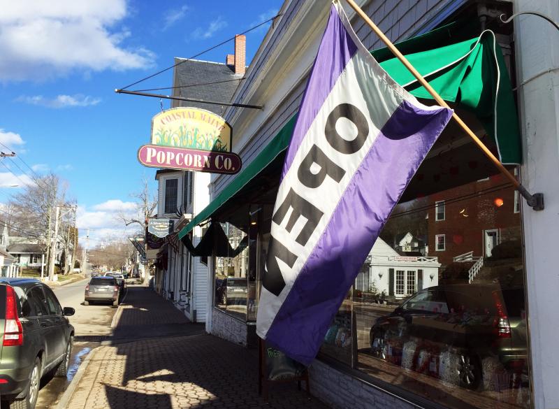 Spelled backward, even the backside of OPEN signs let people know they’re open for business! Open signs are up all over town. SUZI THAYER/Boothbay Register