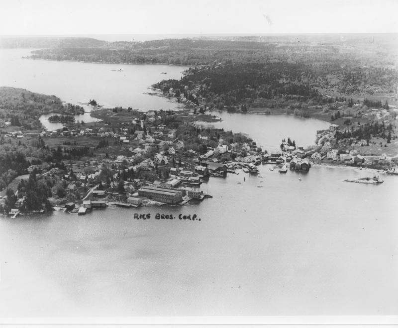 An aerial view of the village of East Boothbay, circa 1936. The millpond is on the right; the small pond on the left is The Marsh between Murray Hill and Paradise Point. In the foreground, the 1936 shipyards arc around the little harbor: Rice Brothers (now Washburn & Doughty), Bernard Rice (now Shipbuilders Park), Goudy & Stevens (now Hodgdon Yachts), and lastly Hodgdon Brothers (now Ocean Point Marina) which is just right of the millpond's outlet. The neck between Linekin Bay and the mill pond keeps the peninsula that extends four miles from the mill pond to Ocean Point from being an island. Courtesy photo