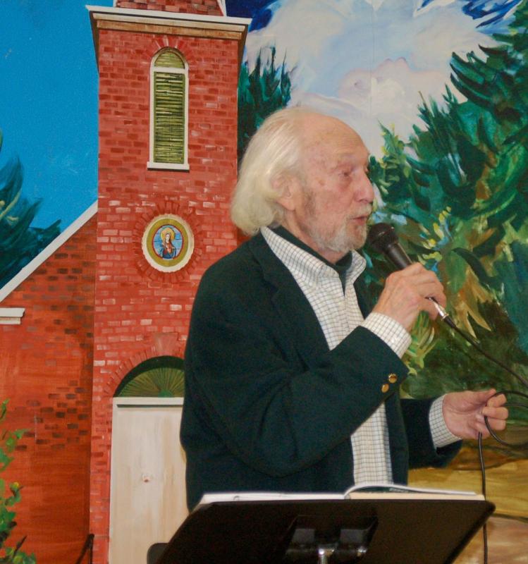 John Reinhardt sings an Irish song in front of a mural of the historic St. Patrick’s Chapel. ART MAYERS/Boothbay Register