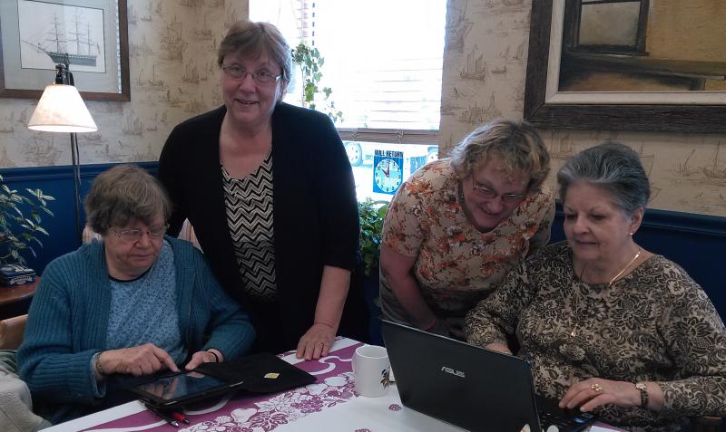 Instructor Lucy Cressey (standing, left) assists (from left) Sandra Barth, Cathy Orne and Betty Sullivan in their search for information. JANE CARPENTER/Boothbay Register
