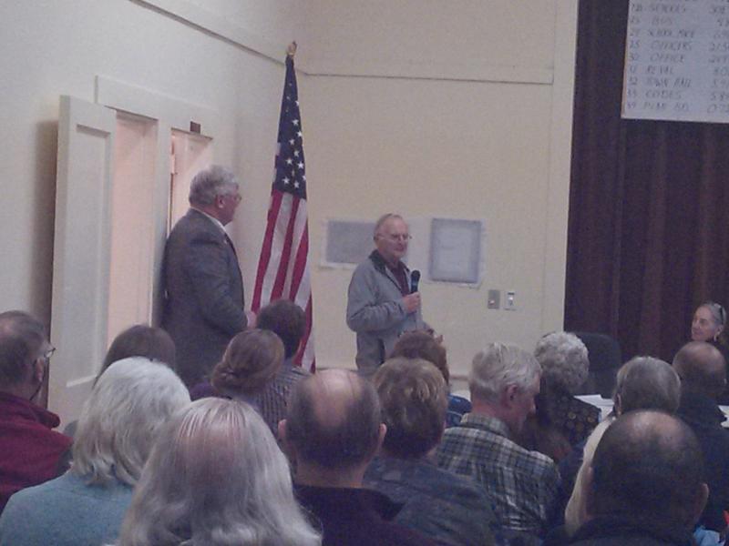 Southport resident Ron Orchard (right) presents a plaque commemorating the 150th anniversary of the town hall. JANE CARPENTER/Boothbay Register