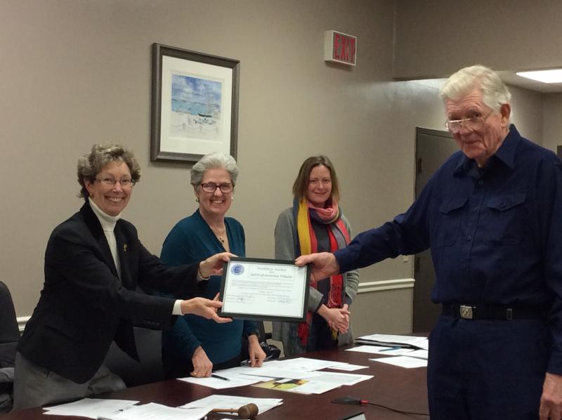 Palmer Payne, right, receives his surprise award from Board Chairman Denise Griffin, left, while selectmen Wendy Wolf (center left) and Tricia Warren (center right) look on. KATRINA CLARK/Boothbay Register